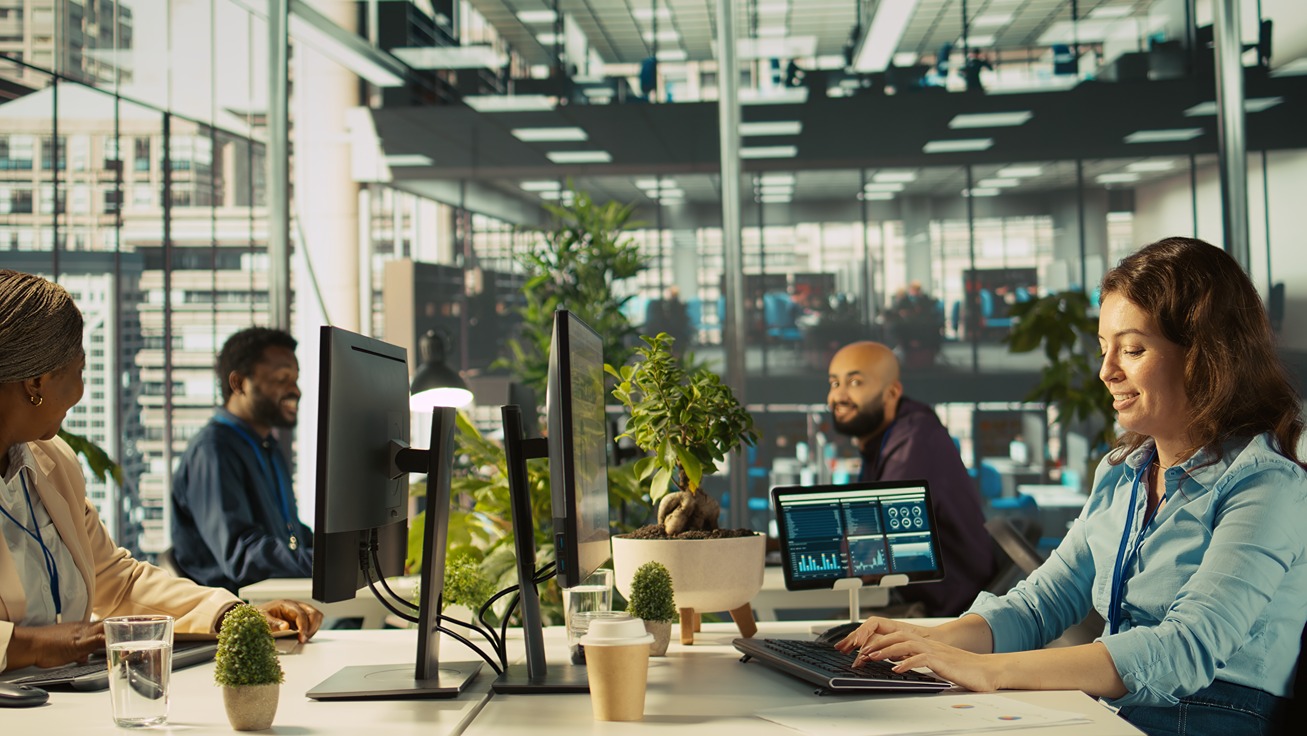 joyous-coworkers-having-fun-vibrant-office-while-reviewing-financial-graphs (1)